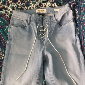 Gently worn stretch, lace up jeans.